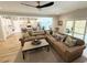 Spacious living room open to kitchen, features stylish seating, wood floors, and natural light at 915 Palmetto St., Georgetown, SC 29440