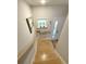 Wood staircase leading to a bright entryway with a window and white door at 915 Palmetto St., Georgetown, SC 29440