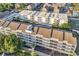 Bird's-eye view of a multi-story condo building with swimming pools and well-maintained landscaping at 9581 Shore Dr. # 127, Myrtle Beach, SC 29572