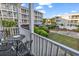 Enjoy the views from the balcony with outdoor seating, overlooking the landscaped common area at 9581 Shore Dr. # 127, Myrtle Beach, SC 29572
