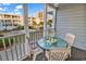 Screened balcony provides an excellent view and outdoor dining space with table and chairs at 9581 Shore Dr. # 127, Myrtle Beach, SC 29572