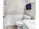 Clean, well-lit half-bathroom featuring a new toilet, sink, and towel rack at 9581 Shore Dr. # 127, Myrtle Beach, SC 29572
