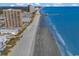 A breathtaking aerial view shows the beautiful beach, pier, and surrounding resorts at 9581 Shore Dr. # 127, Myrtle Beach, SC 29572
