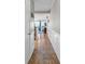 Inviting hallway featuring tile flooring, wainscoting, and an open view into the living area at 9581 Shore Dr. # 127, Myrtle Beach, SC 29572
