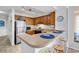 Bright kitchen with breakfast bar, wooden cabinets, stainless steel appliances, and stylish blue accents at 9581 Shore Dr. # 127, Myrtle Beach, SC 29572