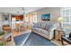 Inviting living area with tile floors and casual furnishings that opens to a kitchen and dining area at 9581 Shore Dr. # 127, Myrtle Beach, SC 29572