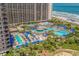 Expansive aerial view of resort pools, the beach, and towering condos under sunny skies at 100 North Beach Blvd. # 515, North Myrtle Beach, SC 29582