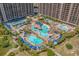 Aerial view showcasing a sprawling resort with multiple pools, palm trees, and inviting lounge areas at 100 North Beach Blvd. # 515, North Myrtle Beach, SC 29582