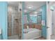Elegant bathroom featuring a jacuzzi tub, tiled shower, and mirrored wall at 100 North Beach Blvd. # 515, North Myrtle Beach, SC 29582