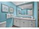 Bathroom with double vanity, white cabinets, framed mirror, and elegant decor at 100 North Beach Blvd. # 515, North Myrtle Beach, SC 29582