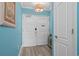 Entryway features light blue walls, plank flooring, white double doors and a foyer table at 100 North Beach Blvd. # 515, North Myrtle Beach, SC 29582