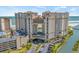 Stunning exterior view of a high-rise resort with beach access, parking, and beautiful architecture at 100 North Beach Blvd. # 515, North Myrtle Beach, SC 29582