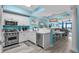 Bright kitchen featuring stainless appliances, white cabinetry, and breakfast bar with seating at 100 North Beach Blvd. # 515, North Myrtle Beach, SC 29582