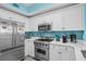 Kitchen featuring stainless appliances, white cabinetry, and solid surface countertops at 100 North Beach Blvd. # 515, North Myrtle Beach, SC 29582
