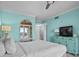 Bedroom with large bed, balcony, and side tables with lamps and decor at 100 North Beach Blvd. # 515, North Myrtle Beach, SC 29582