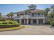 Exterior of 21 Main Prime Steakhouse featuring balconies, pillars, and manicured landscaping at 100 North Beach Blvd. # 515, North Myrtle Beach, SC 29582