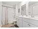 Bathroom featuring a double vanity, white cabinets, modern fixtures, and a shower-tub combo at 1020 Sennema Circle, Myrtle Beach, SC 29588