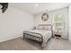 Bright bedroom with a metal frame bed, neutral walls and carpet and a window with blinds at 1020 Sennema Circle, Myrtle Beach, SC 29588