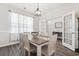 Dining room with hardwood floors, table for six, and decorative lighting fixture at 1020 Sennema Circle, Myrtle Beach, SC 29588