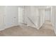Hallway with neutral paint, carpet, and white doors leading to various rooms at 1020 Sennema Circle, Myrtle Beach, SC 29588