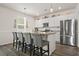 Modern kitchen featuring granite counters, stainless steel appliances, and a four-seater island at 1020 Sennema Circle, Myrtle Beach, SC 29588