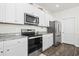 Open kitchen with granite counters, stainless steel appliances, and hardwood floors at 1020 Sennema Circle, Myrtle Beach, SC 29588