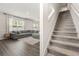 Living room with a comfortable sectional and stairs leading to the next level at 1020 Sennema Circle, Myrtle Beach, SC 29588