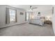 Spacious main bedroom with plush carpet, ceiling fan, and natural light at 1020 Sennema Circle, Myrtle Beach, SC 29588