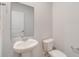 Bathroom featuring a modern sink, a toilet, and neutral walls, offering a simple and clean space at 1023 Laconic Dr., Myrtle Beach, SC 29588
