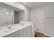 A primary bathroom featuring double sinks, modern hardware, and an enclosed shower space at 1023 Laconic Dr., Myrtle Beach, SC 29588