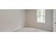 Bright bedroom featuring neutral carpet, gray walls, and a window providing natural light at 1023 Laconic Dr., Myrtle Beach, SC 29588