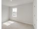 Well-lit bedroom with plush carpet, clean walls, and window at 1023 Laconic Dr., Myrtle Beach, SC 29588
