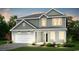 Charming two-story home with a two-car garage, a covered entryway, and freshly landscaped front yard at 1023 Laconic Dr., Myrtle Beach, SC 29588