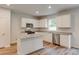 Bright, modern kitchen with stainless steel appliances, granite countertops, and white cabinetry at 1023 Laconic Dr., Myrtle Beach, SC 29588