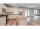 Open kitchen design features granite countertops, stainless appliances, island, and exterior access at 1023 Laconic Dr., Myrtle Beach, SC 29588