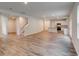 Open-concept space featuring hardwood floors, white walls, stairs and a view into the modern kitchen at 1023 Laconic Dr., Myrtle Beach, SC 29588