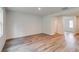 Open-concept living space with hardwood floors and neutral walls, creating a blank canvas for customization at 1023 Laconic Dr., Myrtle Beach, SC 29588