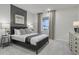 Cozy bedroom featuring neutral walls, a gray accent wall, and plush carpeting at 1035 Laconic Dr., Myrtle Beach, SC 29588