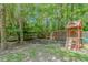 Backyard with a playground, swing set, hammock, and privacy fence at 1050 Hagley Dr., Pawleys Island, SC 29585