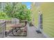 Backyard with a table, door to the house, metal fence, and storage shed at 1050 Hagley Dr., Pawleys Island, SC 29585