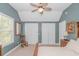 Bedroom featuring neutral carpet, rocking chair, ceiling fan, and two closets at 1050 Hagley Dr., Pawleys Island, SC 29585