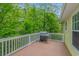 Outdoor deck with grill overlooking a lush green landscape, perfect for outdoor cooking and relaxation at 1050 Hagley Dr., Pawleys Island, SC 29585