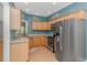 Efficient kitchen featuring stainless steel appliances, ample cabinet space, and a bright window at 1050 Hagley Dr., Pawleys Island, SC 29585
