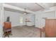 Spacious living room features a ceiling fan, wet bar, and door to the outside at 1050 Hagley Dr., Pawleys Island, SC 29585