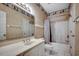 Traditional bathroom with a vanity, toilet, and shower-tub combo, accented by vintage wallpaper and tile flooring at 1058 Sea Mountain Hwy. # 4-203, North Myrtle Beach, SC 29582