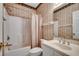 Cozy bathroom with a shower-tub combo, vanity, and patterned wallpaper, creating a functional and vintage space at 1058 Sea Mountain Hwy. # 4-203, North Myrtle Beach, SC 29582