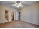 Comfortable bedroom featuring a ceiling fan, neutral carpet, and multiple entryways, providing a cozy private space at 1058 Sea Mountain Hwy. # 4-203, North Myrtle Beach, SC 29582