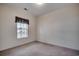 Neutral bedroom with a window providing natural light, carpet flooring, and ample space for personalization at 1058 Sea Mountain Hwy. # 4-203, North Myrtle Beach, SC 29582