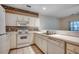 Bright kitchen featuring white cabinetry, appliances, and countertops, offering a clean and functional cooking space at 1058 Sea Mountain Hwy. # 4-203, North Myrtle Beach, SC 29582