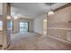 A spacious living room with neutral carpet, sliding glass doors, and natural light at 1058 Sea Mountain Hwy. # 4-203, North Myrtle Beach, SC 29582